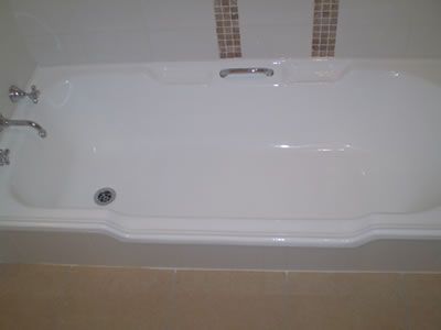 After: a stained built-in bath