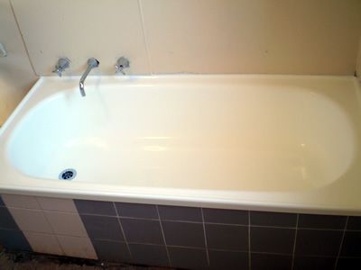 After: a worn enamel bath
